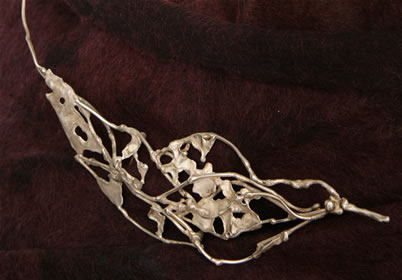 Forged brooch